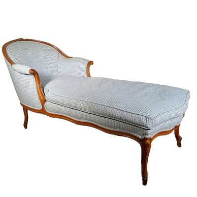 CARVED WOOD LOUNGER | Blue and white gingham cushions with curved back and scrollwork carving in arms. - l. 61 x w. 29 x h. 32 in 