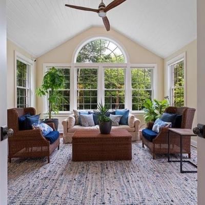 A sun room decked out in Restoration Hardware and Pottery Barn furnishings brings the outdoors in!