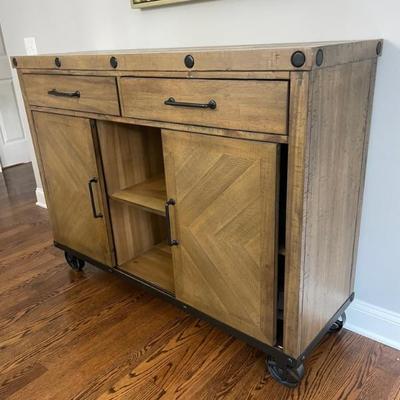 Nevada Pub Natural Server - server in distressed finis , features large metal wheels and metal bolts 55" W x 18" D x 42" H