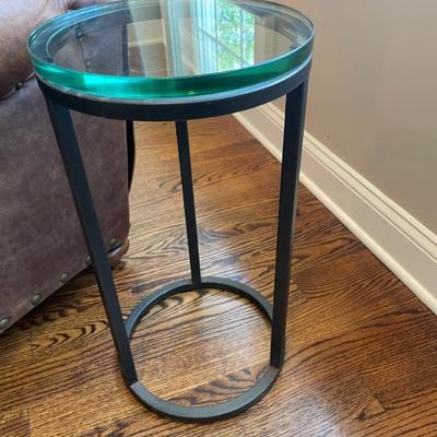 Black metal round side table with glass top