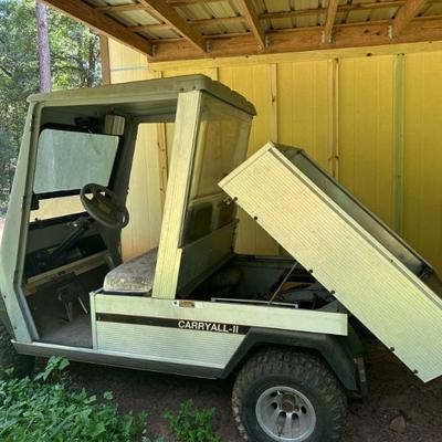 Gas powered golf cart with tilt bed and cab enclosure  