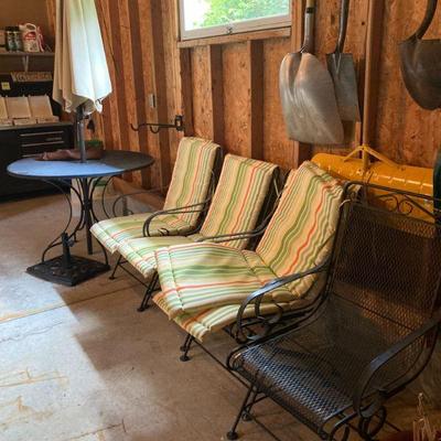 Wrought iron table, umbrella & stand and 4 rocker chairs