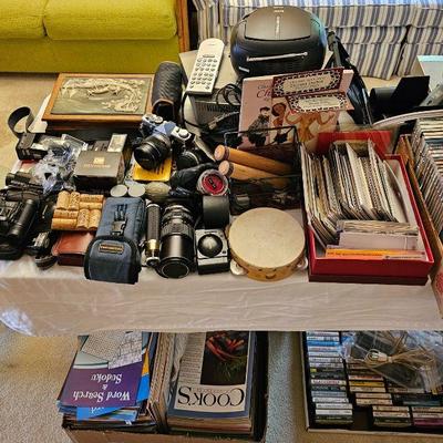 Camera's & accessories, assorted electronics & postcards.