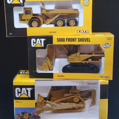 Lot 035-MT: CAT Die-cast Work Equipment Trio #3

Features:
â€¢	CAT Diecast D11R Track-Type Tractor, no. 55025
â€¢	CAT Diecast 5080 Front...