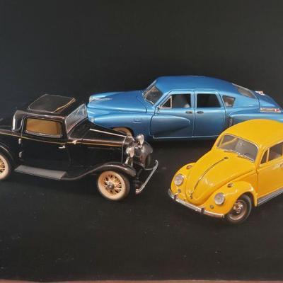 Lot 038-MT: Franklin Mint Die-cast Trio

Features:
â€¢	Franklin Mint Diecast 1967 Volkswagen Beetle
â€¢	Franklin Mint Diecast 1932 Ford...