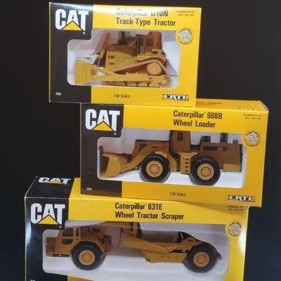 Lot 034-MT: CAT Die-cast Work Equipment Trio #2

Features:
â€¢	Caterpillar Diecast 631E Wheel Tractor Scraper, no. 2430
â€¢	Caterpillar...