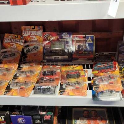 #6138 â€¢ NEW!!! Shelf of Nascar Toys & Collectibles
