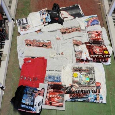 #6150 â€¢ Shelf of Collectible Dale Earnhardt / Jr T-Shirts, Jacket, & CD
