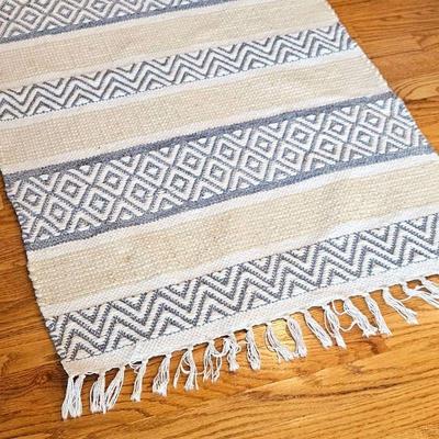 Handwoven Rug in Soothing Tones and Playful Tassels
