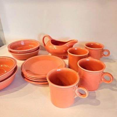 13 Pcs of Fiestaware Orange dishes, mugs and gravy boat