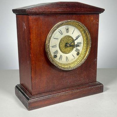 Clock w/Mahogany Case | Has brass works w/pendulum. No makers name noted. - l. 10.5 x w. 5.250 x h. 11.5 in
