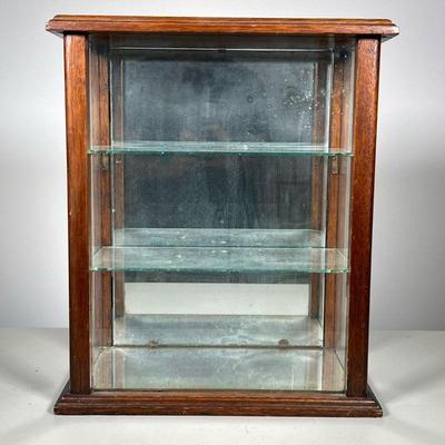 Glass Display Cabinet | Cabinet with two glass shelves Has mirrored back and bottom. Case opens from back. - l. 13.75 x w. 8.5 x h. 16 in
