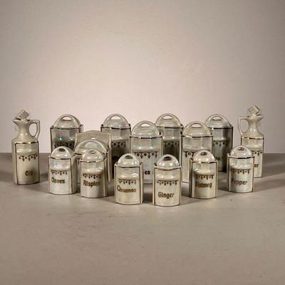 (15pc) Miniature Canister Set | Mini Cereal Set marked Germany. - l. 1.25 x w. 1 x h. 3.25 in (Oil bottle)
