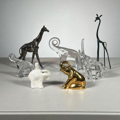 (7pc) Animal Figurine Lot | Includes: 2 metal giraffe figurines, 3 glass elephants, 1 gold painted elephant, and 1 Nutbrown Pie Funnel...