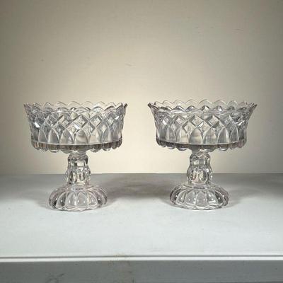  (2pc) Pair Of Compotes | Pair of pressed glass compotes in diamond and loop pattern. - h. 8.5 x dia. 8.5 in 