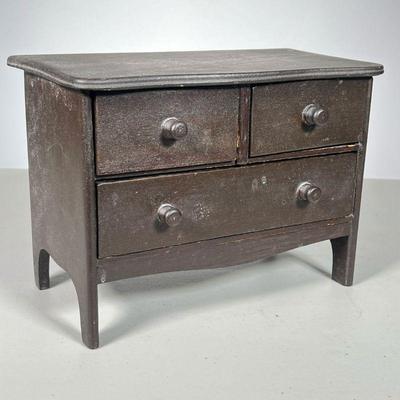 Miniature Chest | Chest in brown stain with satin-lined drawers. - l. 9.5 x w. 5 x h. 7 in 