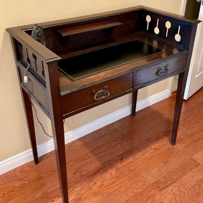 Antique desk with cut outs and leather inlay
