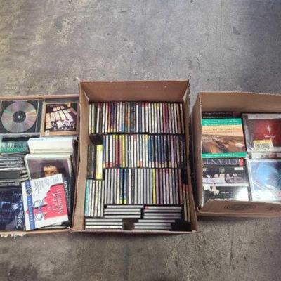 #1034 â€¢ 3 Boxes of Assorted CD's and DVD's
