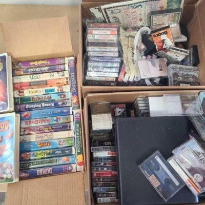 #1040 â€¢ Assorted Cassetes, CD's, DVD's, and VHS Tapess
