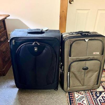 (2) Rolling Suitcases Atlantic And Delsev & (2) Luggage Racks
