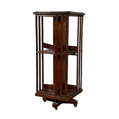 REVOLVING BOOKCASE | Revolving Two Tier Bookcase of small size.Brass molding along tops edges with a design in each corner. 