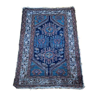 SMALL ANTIQUE RUG | Geometric devices, having four guls in scrollwork, ivory border with decorations. 