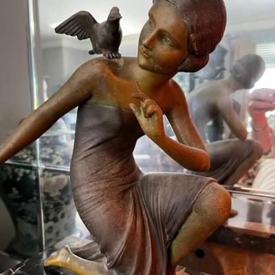 French Art Deco spelt statue of a woman with birds, bronze finish and marble base