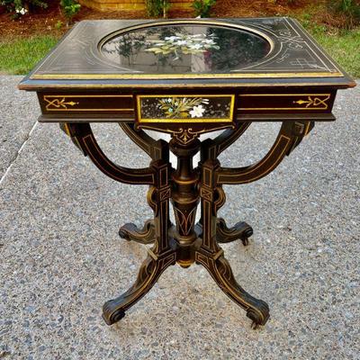 Lot 009-DG: Antique Lacquered Wooden Side Table 

Features: 
â€¢	Sturdy, 4-legged pedestal side table
â€¢	Lacquered wood with gilt-inlay...