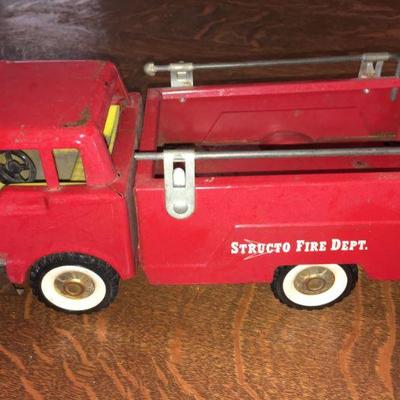 Lot 055-MT: Vintage Structo Fire Dept. Truck

Features: Vintage pressed-steel toy fire truck with knobby, hard-rubber wheels....