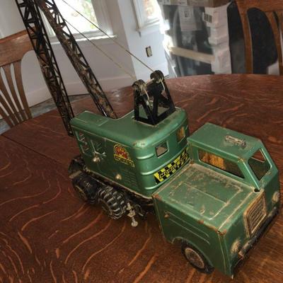 Lot 056-MT: Vintage Lumar Contractors Mobil Crane

Features: Large, 3-axle, vintage green pressed-steel construction toy

Dimensions:...