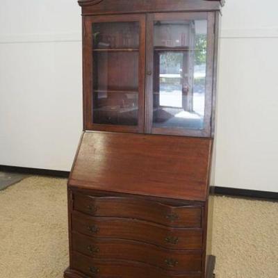 1134	MAHOGANY SECRETARY DESK W/DOUBLE DOOR BOOKCASE TOP, APPROXIMATELY 35 IN X 19 IN X 84 IN HIGH
