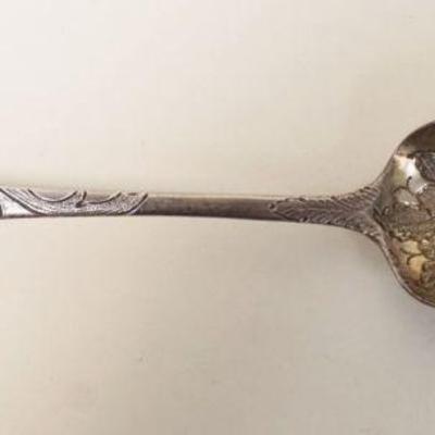 1077	ORNATE CONTINENTAL SILVER SPOON W/EMBOSSED DESIGNS, 1.38 OZT, TOUCH MARKS ON REVERSE
