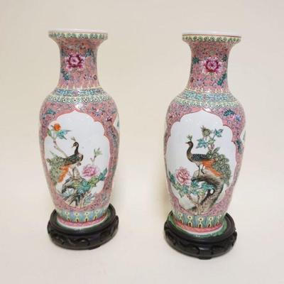 1053	PAIR OF ASIAN VASES ON WOOD BASES, VASES ATTACHED TO WOOD BASES, APPROXIMATELY 14 IN
