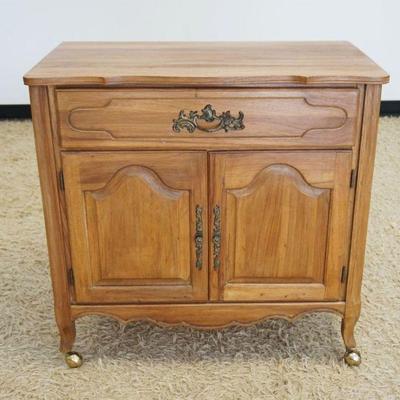 1130	FRENCH PROVINCIAL OAK ONE DRAWER 2 DOOR STAND, APPROXIMATELY 33 IN X 19 IN X 33 IN HIGH
