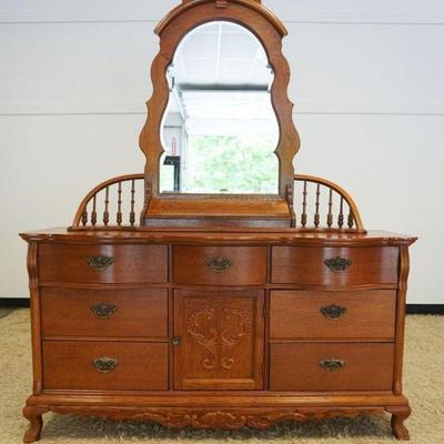 1105	OAK LEXINGTON CHEST W/BEVELED MIRROR TOP & ARCHED GALLERY TURNED SPINDLE BACK, 7 DRAWER, ONE DOOR, APPROXIMATELY 64 IN X 21 IN X 83 IN
