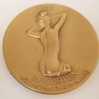 1243	BRONZE COMMEMORATIVE COIN MEDDALIC ART CO NY OF NUDE WOMAN, APPROXIMATELY 2 1/2 IN
