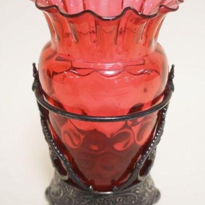 1071	VICTORIAN CRANBERRY GLASS VASE IN ORNATE SILVERPLATE HOLDER, JAMES W TUFTS, APPROXIMATELY 7 IN HIGH
