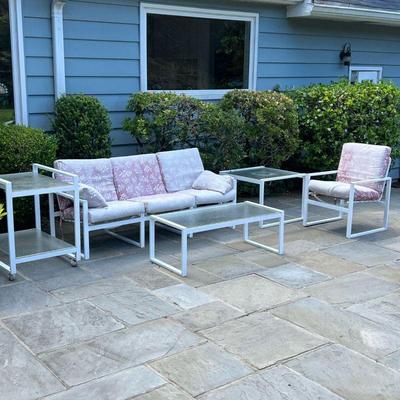 MEDALLION LEISURE FURNITURE MID CENTURY PATIO SUITE | Includes white aluminum armchair and couch with floral pink cushions, small...