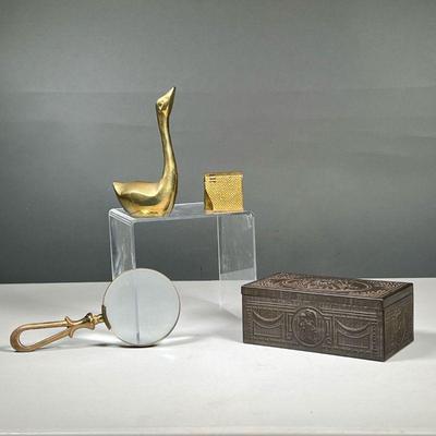 (3PC) METAL DESK ITEMS | Including a magnifying glass with a brass loose handle, a state, Express cigarette box with pressed tin...