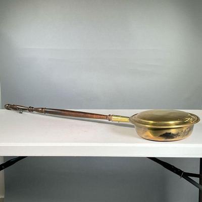 ANTIQUE BRASS BED WARMER | Brass bed warmer with copper rivets and spindle handle. - l. 43.5 x h. 3.5 in
