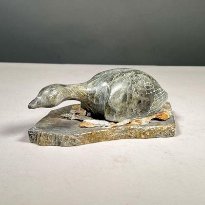 GLENN TINGOOK HAND CARVED STONE DUCK | Carved stone duck figurine on cut stone base with rock chip nest. signed on bottom. - l. 7 x w. 4...