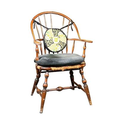 SACK BACK WINDSOR ARMCHAIR | Having a sack back with rush seat, old finish. - l. 26 x w. 25 x h. 38.5 in
