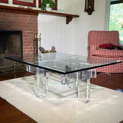 LUCITE & GLASS LOW TABLE | Tempered glass top on a brutalist style Lucite base. - l. 48 x w. 36 x h. 17 in
