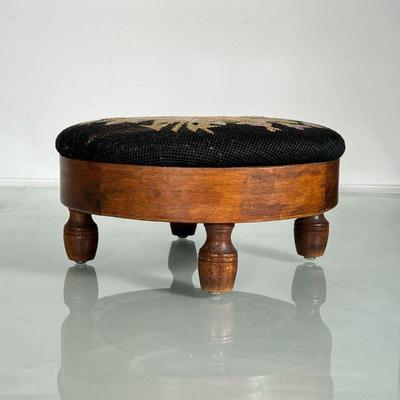 ANTIQUE NEEDLEPOINT FOOTSTOOL | Small antique footstool with floral needlework cushion on top. - h. 6 x dia. 11.25 in
