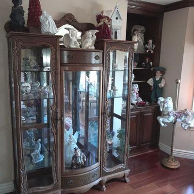 Antique curved glass cabinet with claw feet