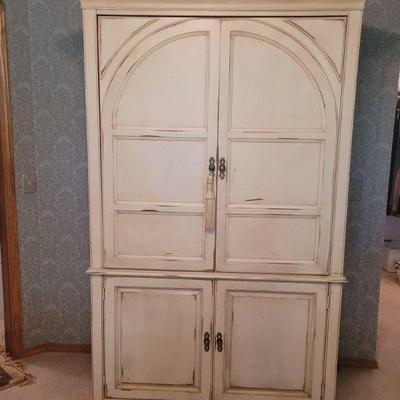 Elegant white entertainment armoire