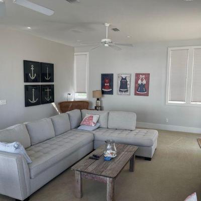 one of two like new sectional sofas
