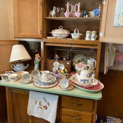Antique Hoosier Cabinet filled with vintage, antiques, dishes and serving pieces