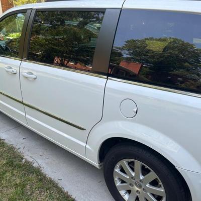 Town & Country has just under 74,000 miles and current on oil change