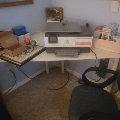 Corner desk and a printer
